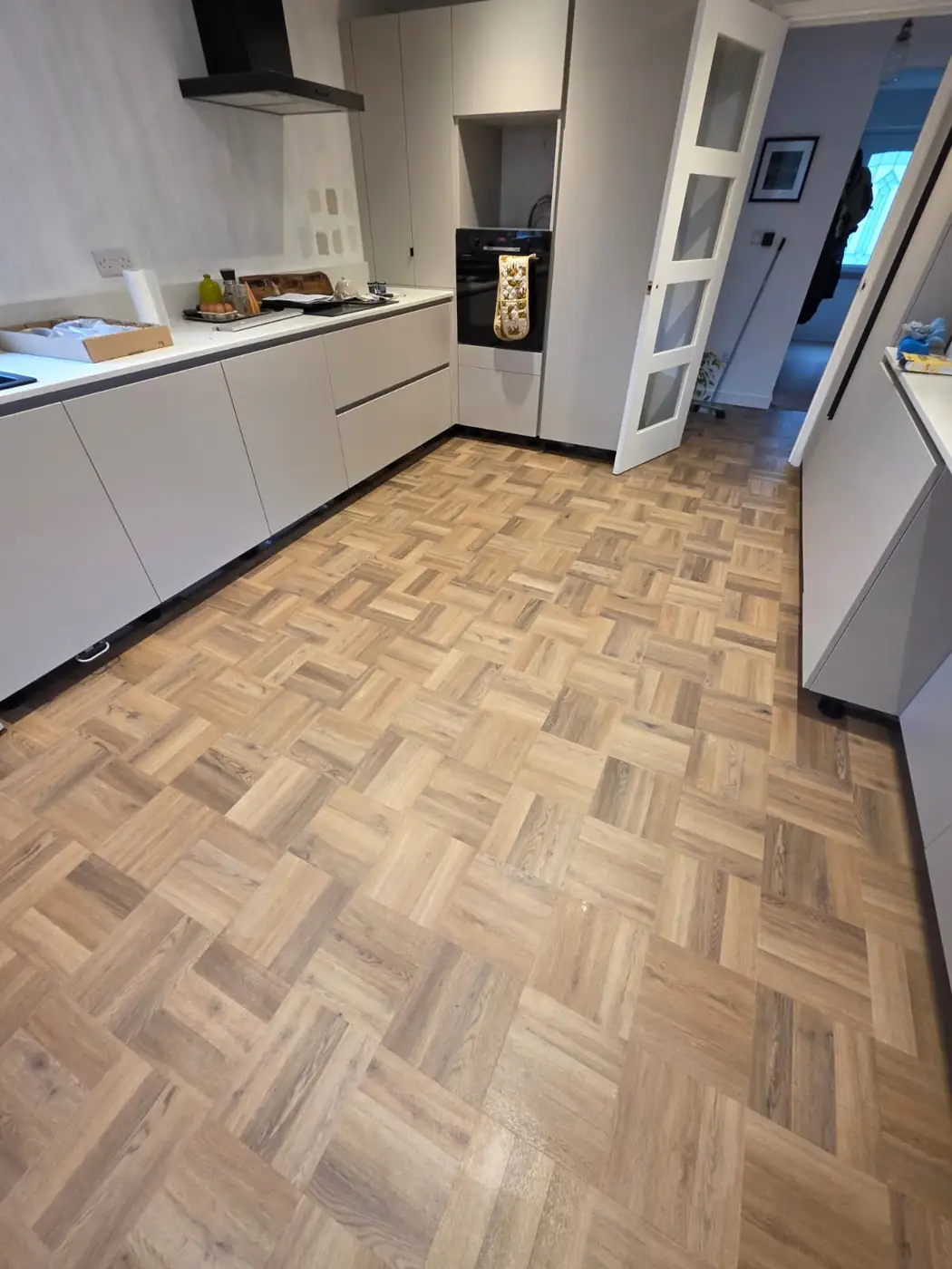 Herringbone luxury vinyl tile kitchen flooring