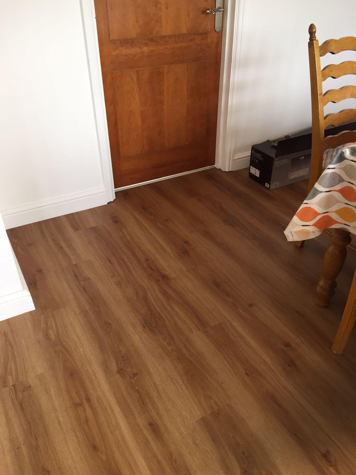 Wood-effect luxury vinyl tile hallway flooring